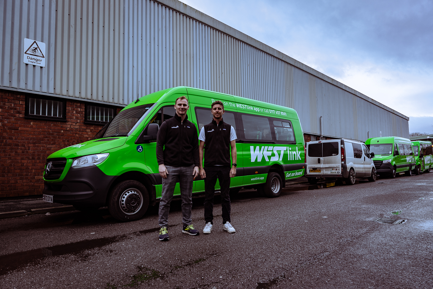 The founders Dan Mould and Charlie Crawford with a WESTlink bus on launch day