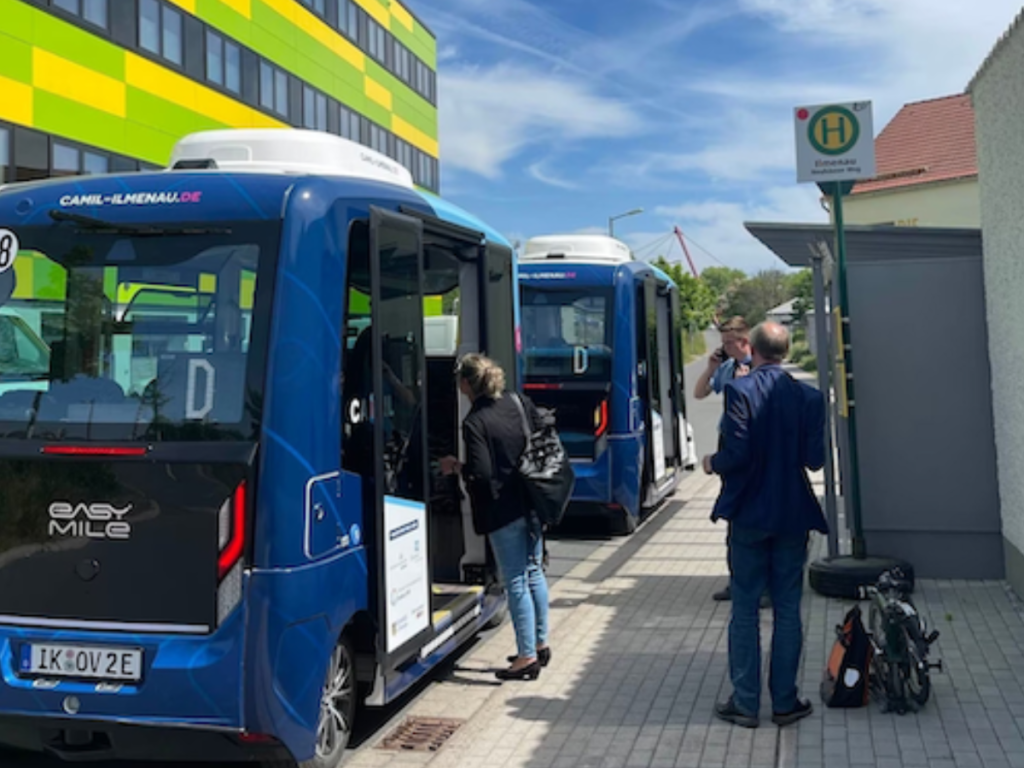 Two autonomous shuttles at a bus stop in Germany