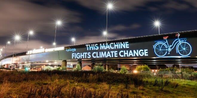 A sign which reads "this machine fights climate change"