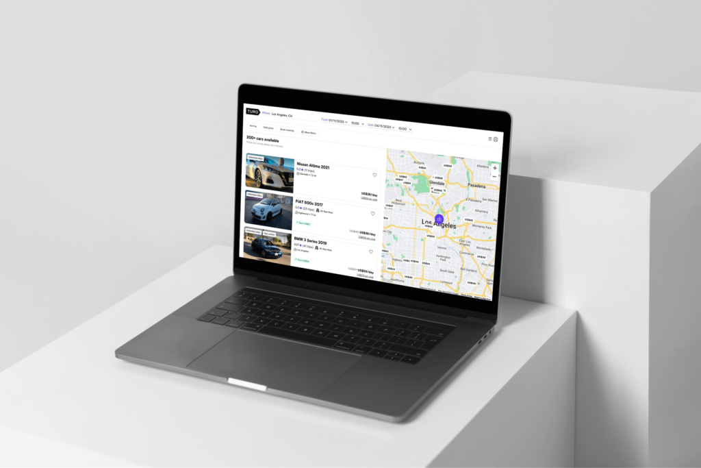 A laptop displaying the TURO car rental website