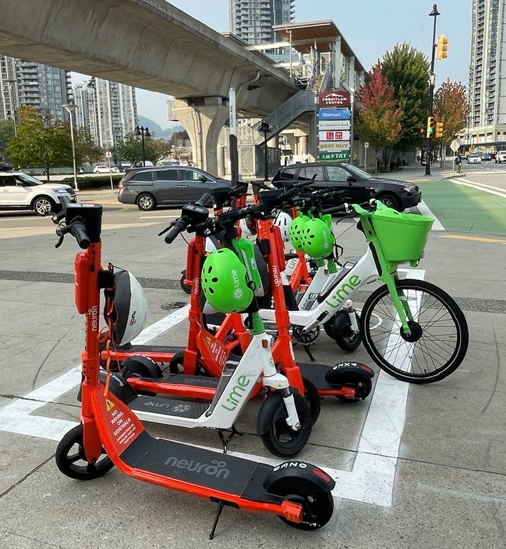 A lineup of e-scooters in the street