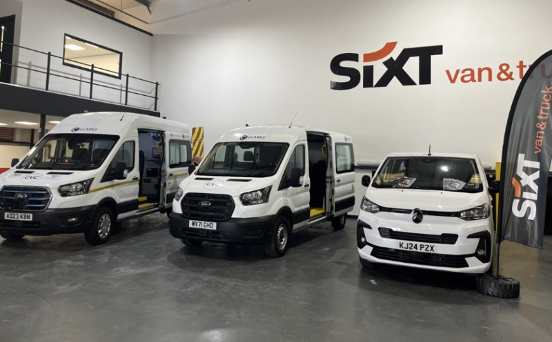 three SIXT vans standing in the warehouse.