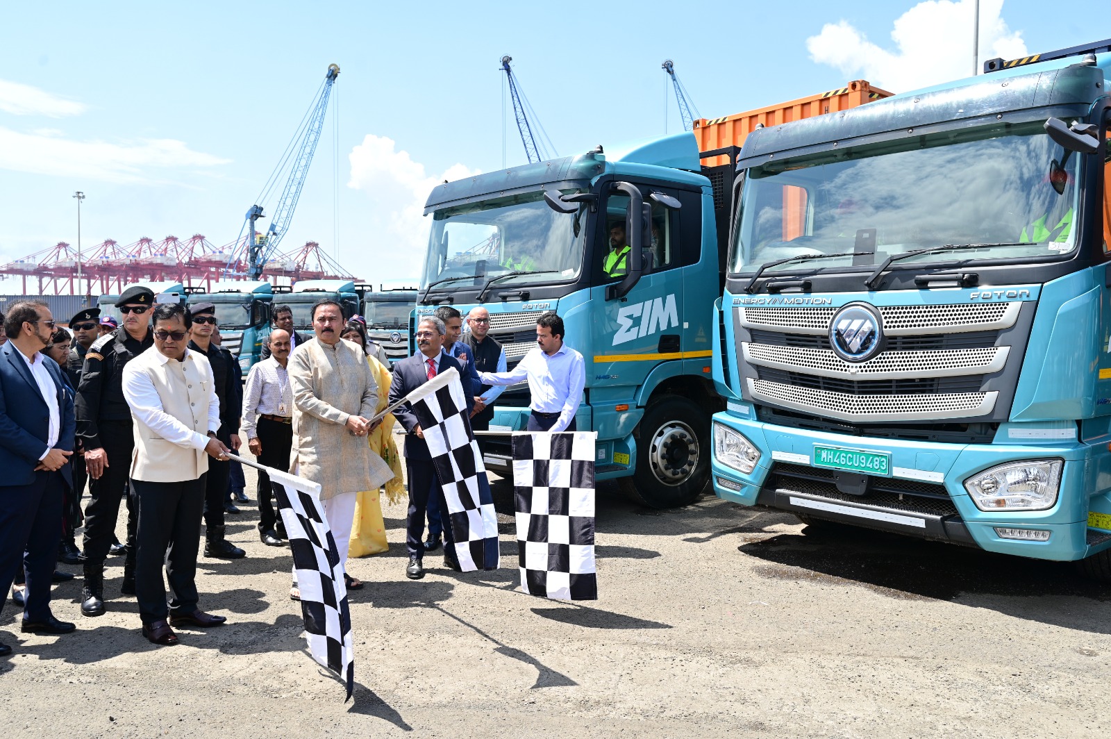 A set of trucks being flagged off