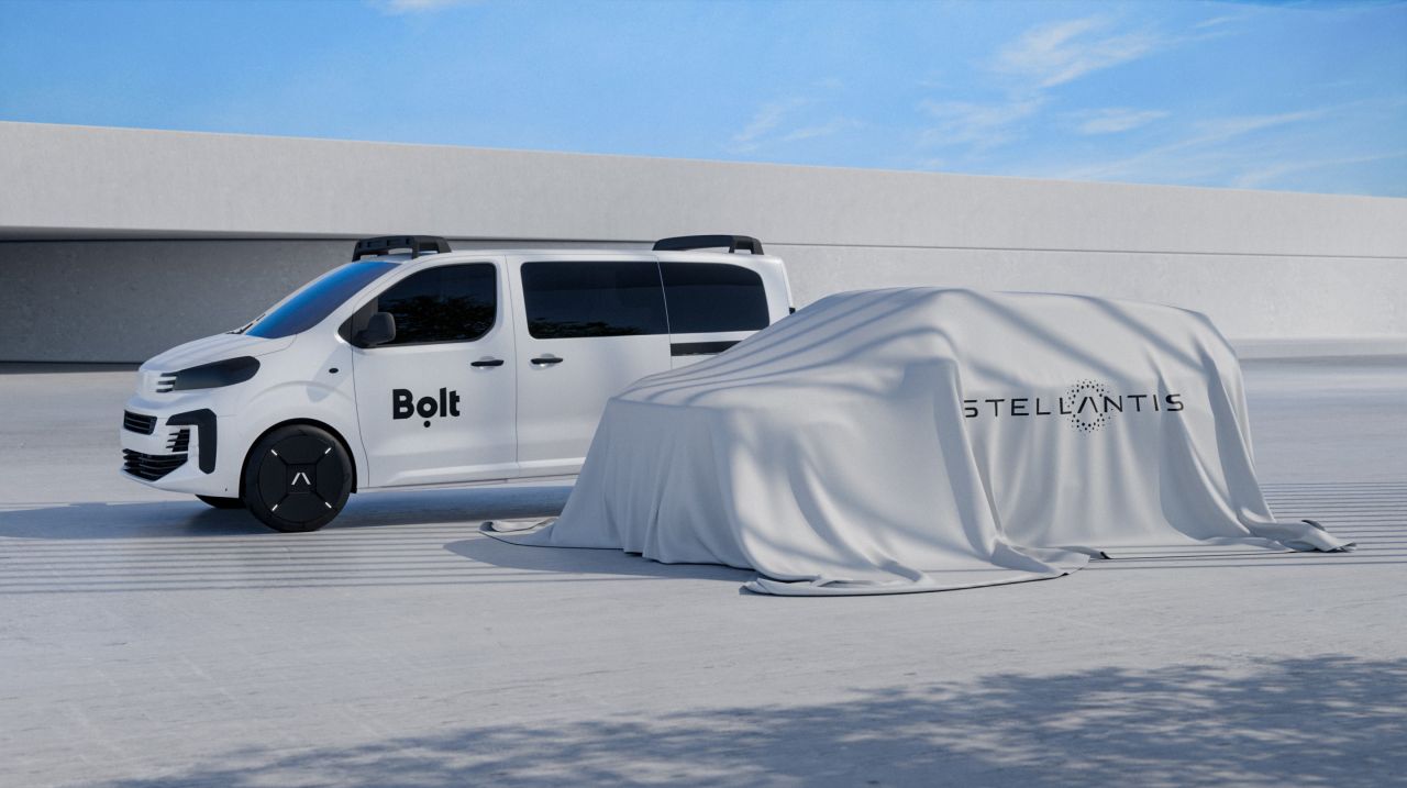 Two vehicles, a Bolt minivan and a Stellantis vehicle hidden under a sheet
