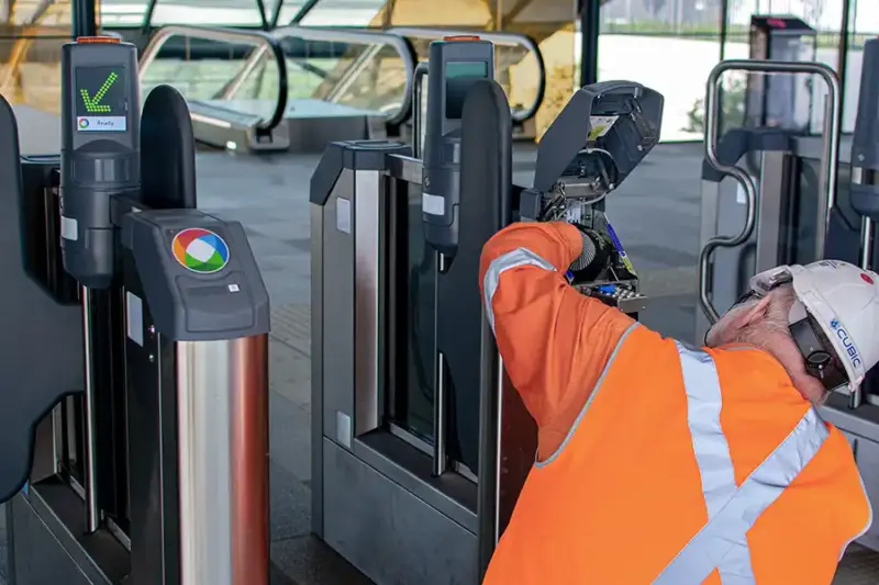maintenance man fixing a gate