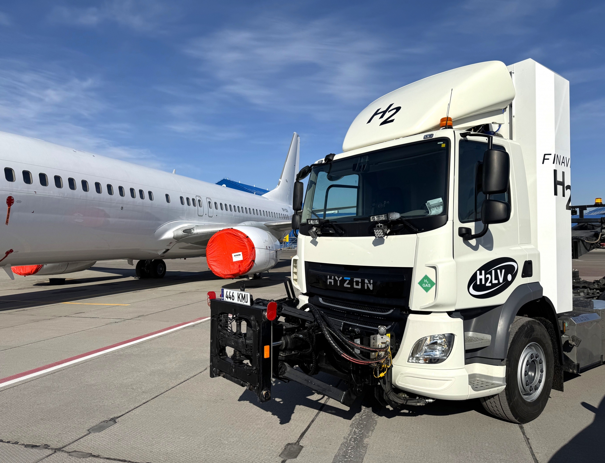 The Hyzon truck by an airplane