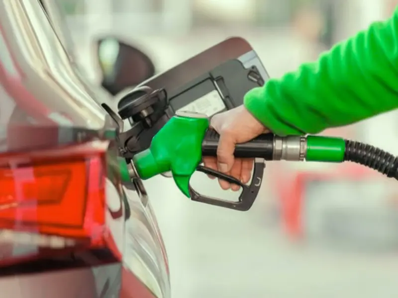 Someone filling up a car with petrol